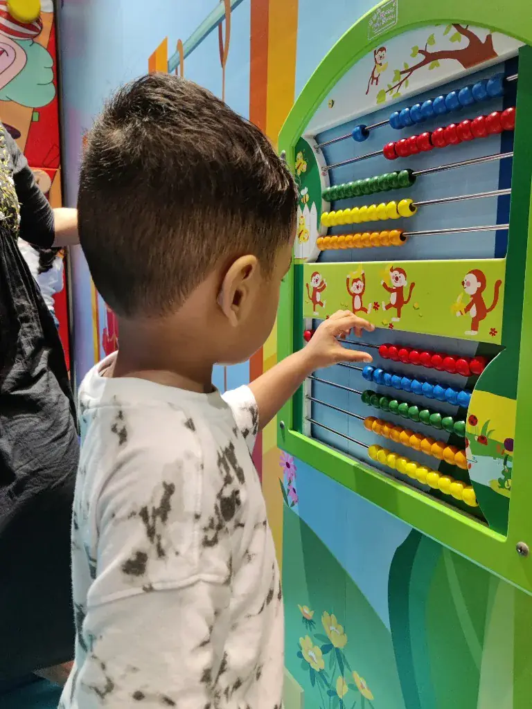 A child learning with an abacus at ULTRA_school Kochi