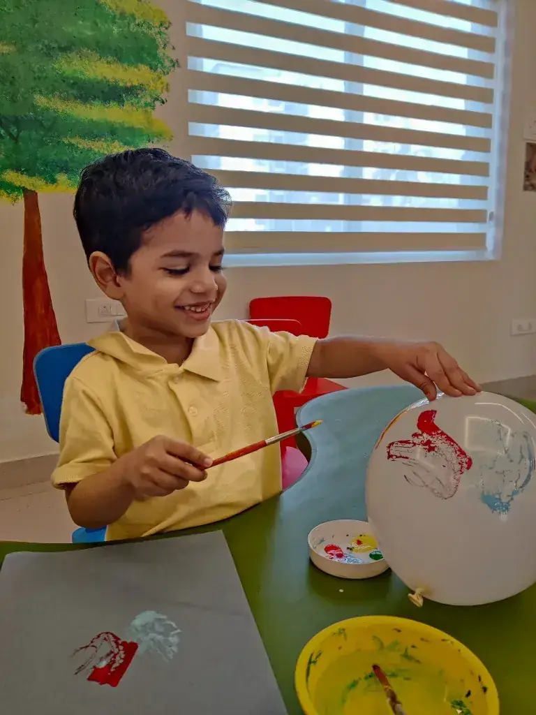 Child painting and creating at ULTRA_school studio in Kochi