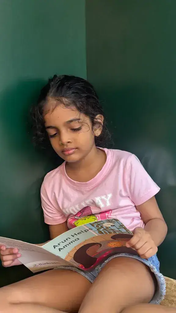 Child reading quietly in a nook at ULTRA_school